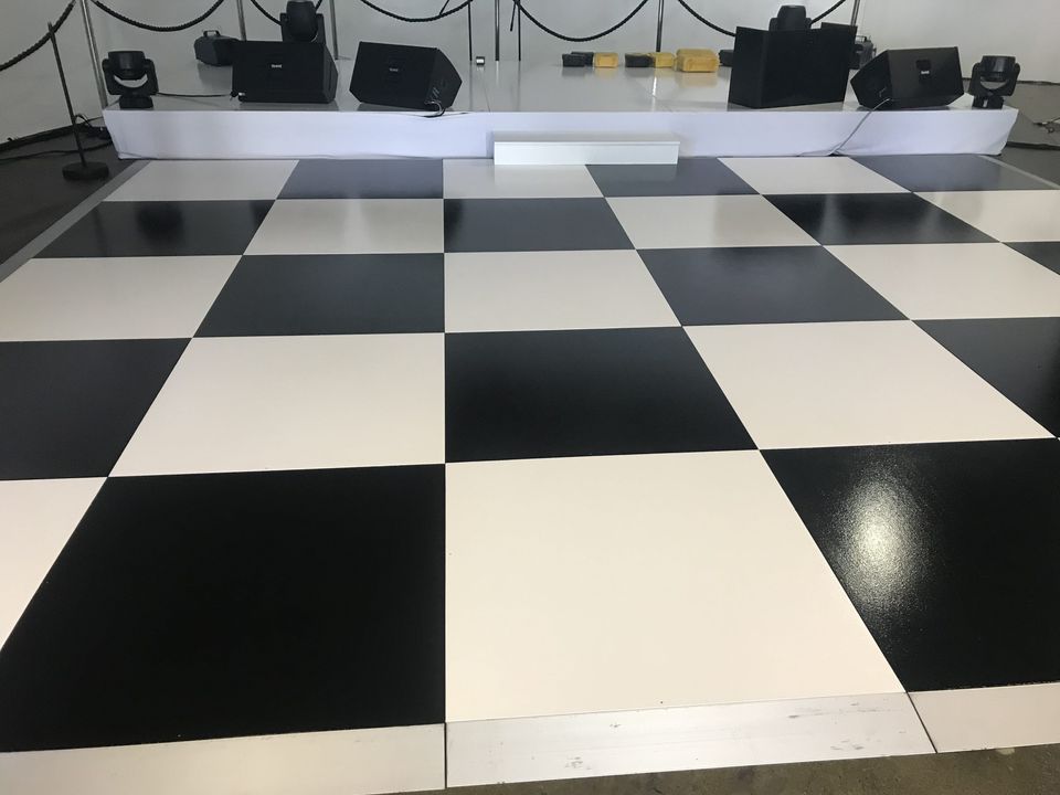 Black and white checkered floor at a gala event