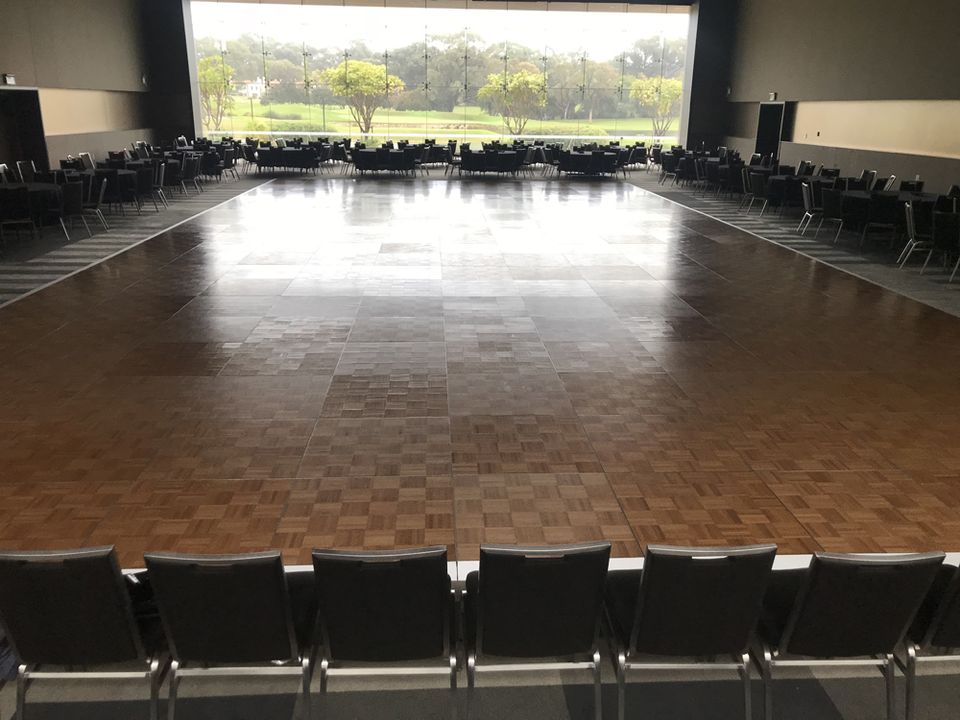 Parquetry dance floor in a venue with river views