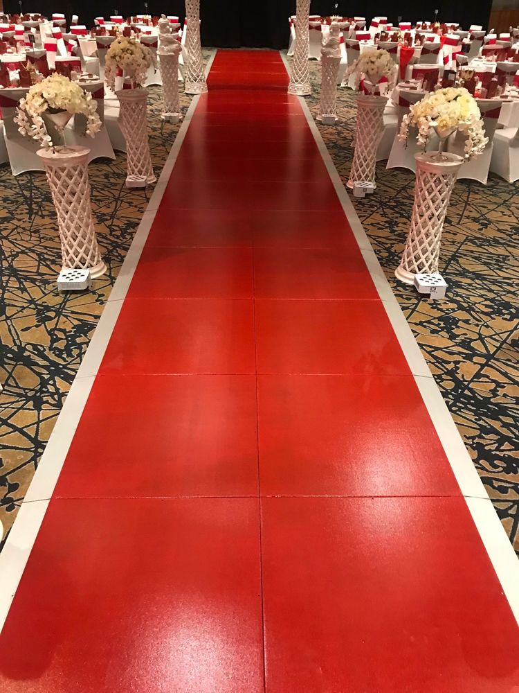 Red gloss aisle runway between chairs