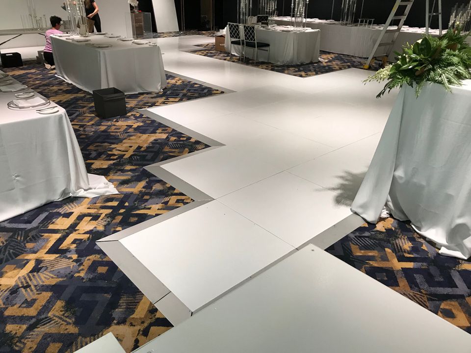 White runway staging through a function room